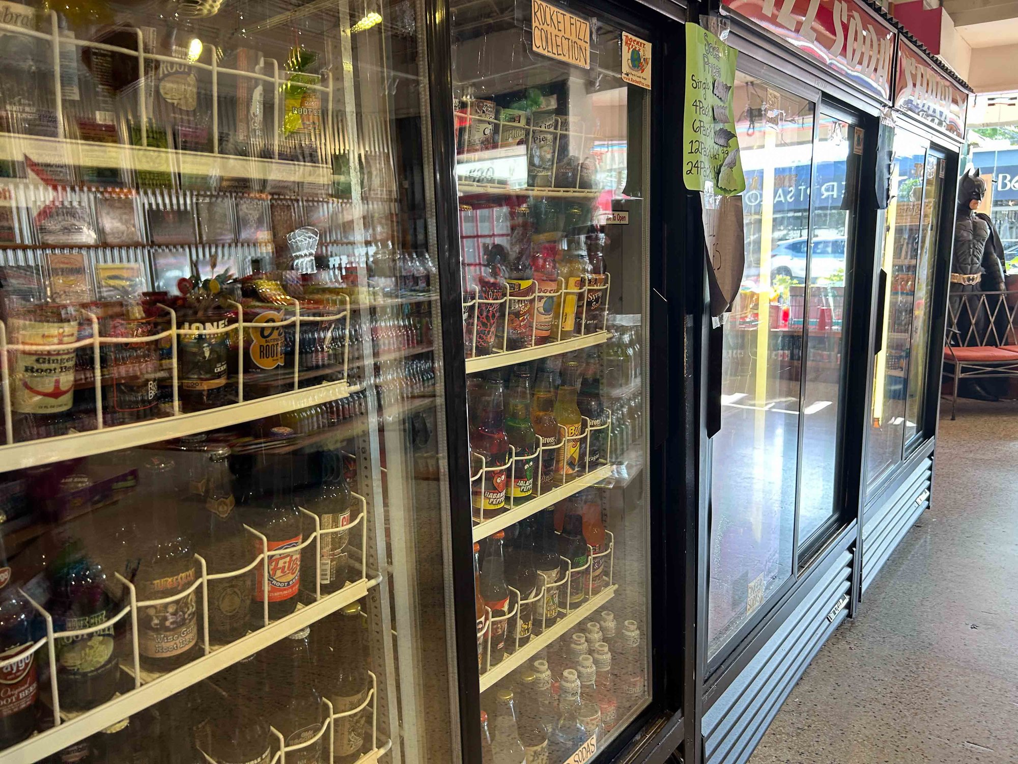View of fridge with sodas inside